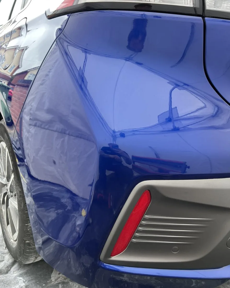 Blue rear bumper after cosmetic repair